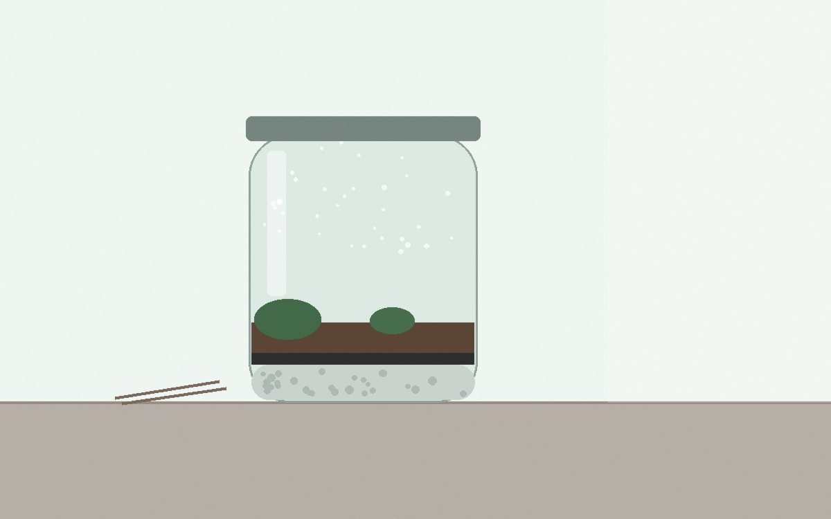 A spray bottle set to fine mist above a jar with the lid resting beside it